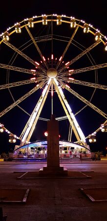 Night view of Illuminated giant Ferris wheel of Bari, region of Apulia, Italy.の写真素材