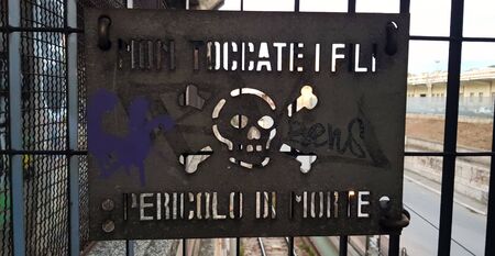 BARI, ITALY, APRIL 2019: dont touch, danger of death, written in Italian with skull and crossbones.のeditorial素材