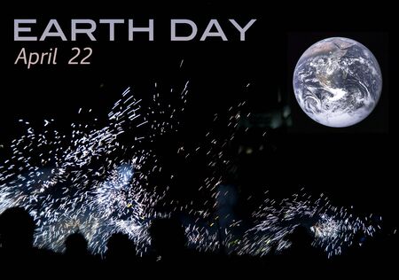 Silhouette of people watching the planet on the Earth Day celebrations.の写真素材