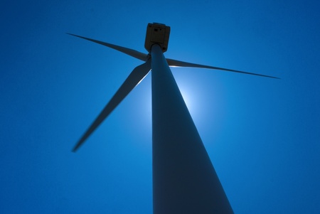 Backlight windmill against a blue skyの写真素材