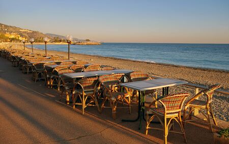 France, winter evening in the resort Menton, deserted beach at sunsetの写真素材