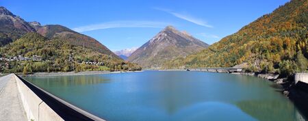 Autumn landscape. French hydro power: Dam in the mountainsの写真素材