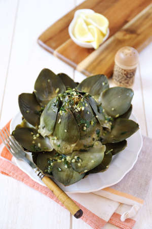 Steamed Artichokes with Lemon Herb Sauceの写真素材
