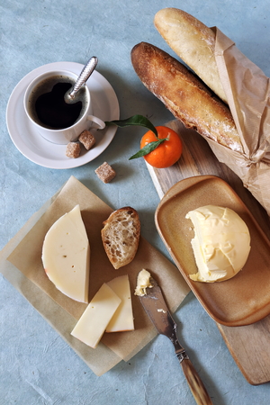 Breakfast: fresh baguette, French cheese and butterの写真素材