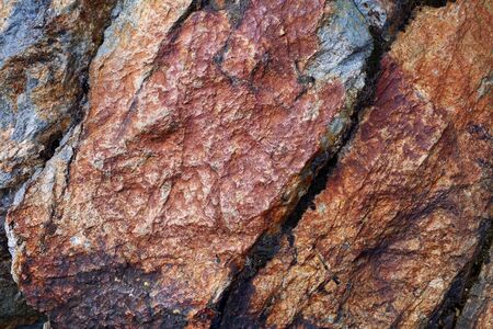 Background: stone multicolored rock texture