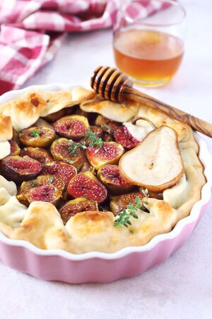 Homemage figs and pears galette with honeyの写真素材