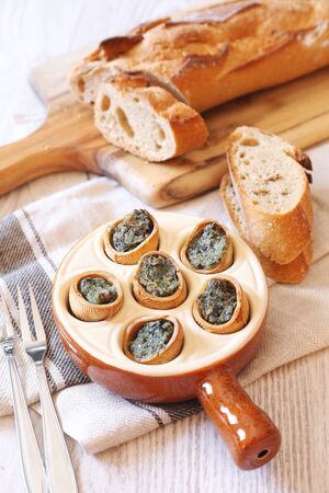 Escargots, traditional French dish: snails and baguetteの写真素材
