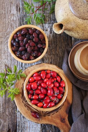 Rosehip berries, fresh and dried. Rustic style, top viewの写真素材