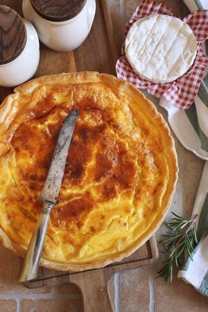 French cuisine. Norman Camembert cheese tart. Rustyc style, top viewの写真素材
