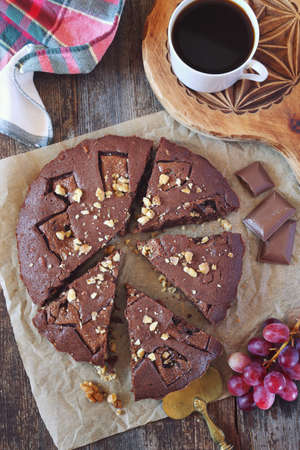 Kladdkaka, Swedish chocolate cake and cup of coffee. Top view, toned imageの写真素材