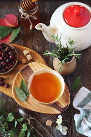 Healthy herbal tea with medicinal herbs, dog rose and honey. Rustic style, top viewの写真素材