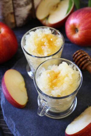 Apple granita with honey, frozen summer dessert on dark background, selective focusの写真素材