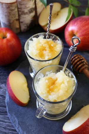 Apple granita with honey, frozen summer dessert on dark background, selective focusの写真素材