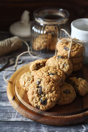 Homemade oatmeal cookies with raisins and walnuts, rustic styleの写真素材
