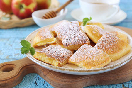 Austrian cuisine. Torn pancake (or omelet) kaiserschmarrn with honey, powdered sugar dressing and...