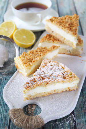 Italian cuisine. Lemon and ricotta (cottage cheese) grated tart and cup of tea