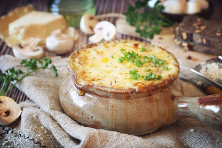 Mushroom julienne baked with cheese, rustic styleの写真素材