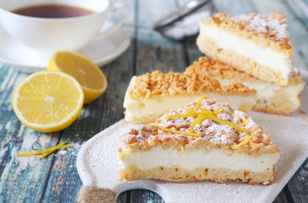 Italian cuisine. Lemon and ricotta (cottage cheese) grated tart and cup of teaの写真素材