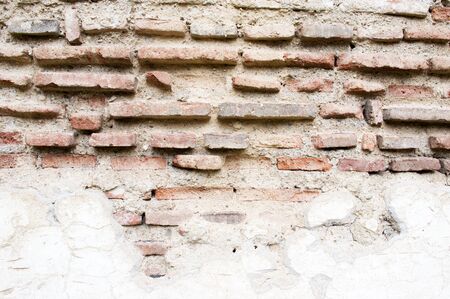 Old decayed stone brick wall background