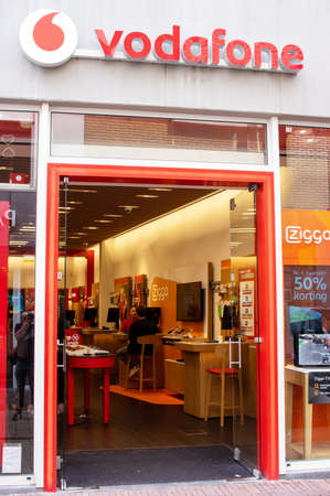 Arnhem, Netherlands - August 16, 2019: Entrance of a Vodafone store. Vodafone is a British...