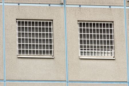 Modern prison windows with metal barsの写真素材
