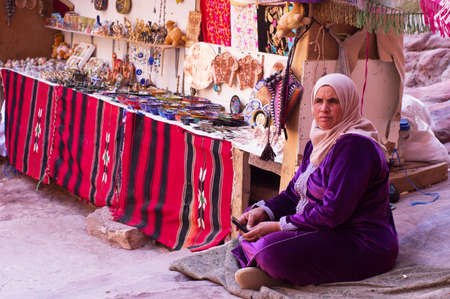 Women  is selling  souvenirs at street market stallのeditorial素材