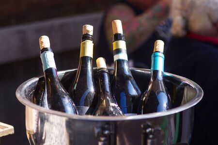 Bottles of champagne in ice bucketの写真素材