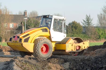 Heavy yellow asphalt roller for road work
