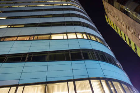 Close-up of a modern office building at night in Arnhem, Netherlands
