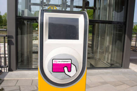 Elst, Netherlands - May, 2020: Public transport check in / out at station Elst