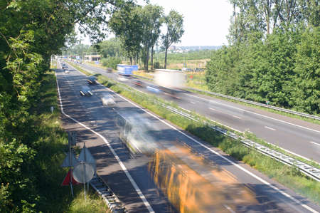 Highway with cars that are blurred by motion at daytime near Arnhem, Netherlands