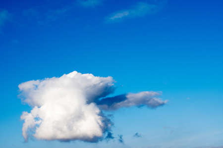 Clear blue sky with large cumulus cloudの写真素材