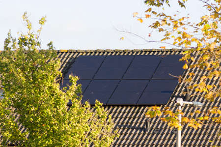 Solar panels on a brown roof for electric power generation