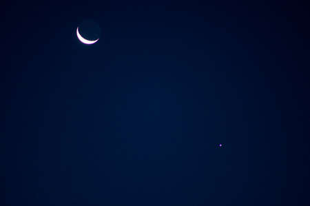 Celestial conjunction of a crescent Moon and the planet Venus