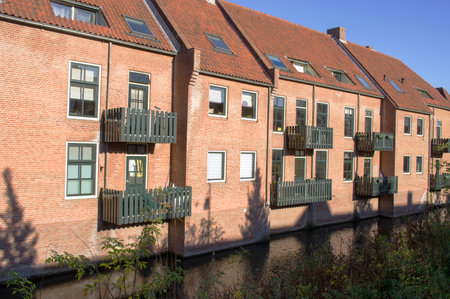 Back of houses in a row on the water in Zutphen, Netherlandsのeditorial素材