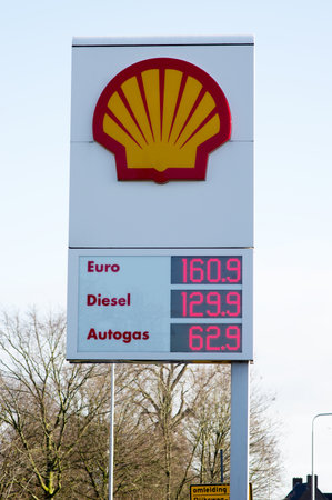 Elst, Netherlands - January 9, 2021: Large information pillar with fuel prices at a Shell gas stationのeditorial素材