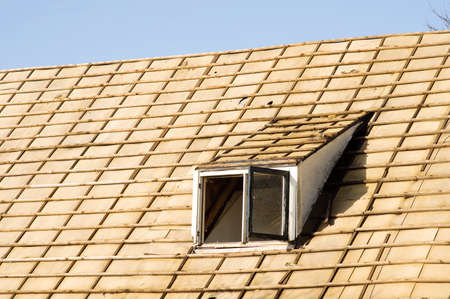 Closeup of a roof without tiles of a old farm