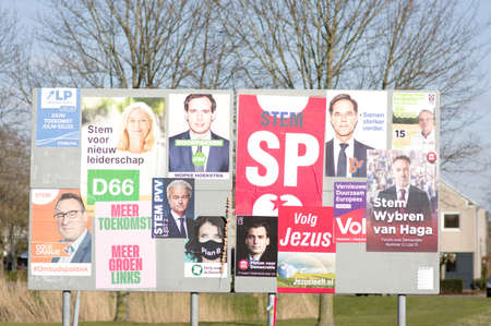 Elst, Netherlands - February 24, 2021: Billboard with dutch political campaign posters for the Dutch...