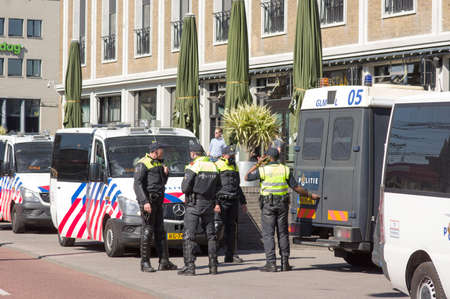 Arnhem, Netherlands - April 27, 2021: Dutch police officers in the center of Arnhem prepare to maintain orderのeditorial素材