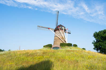 Traditional historic windmill on a green hill in the center of Wijchen in the Netherlandsのeditorial素材