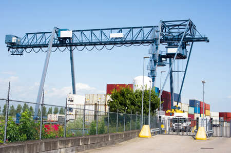 Container terminal with blue large industrial container crane in Doesburg in the Netherlands