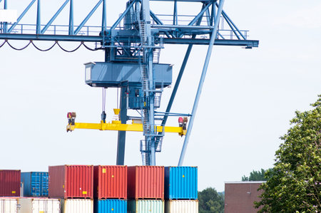 Closeup of a blue industrial crane of a container terminal in Doesburg in the Netherlands