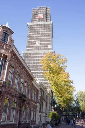 Utrecht, Netherlands - October 24, 2021:Tower of the Dom church in scaffolding with a clear blue skyのeditorial素材