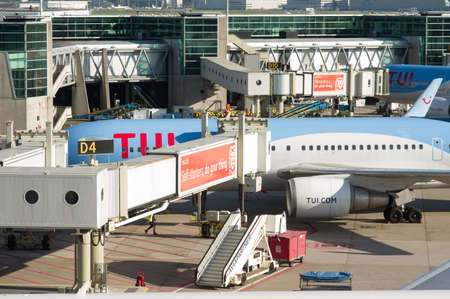 Schiphol, Netherlands - October 28, 2021: Airplane of TUI is parked for service at airfield Schiphol