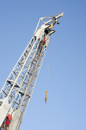 Closeup of a large gray tower crane