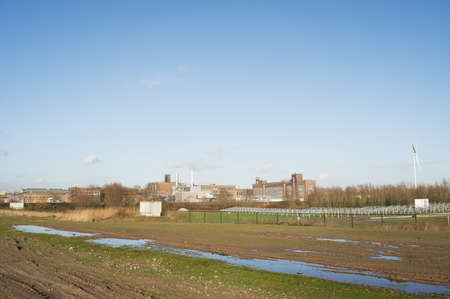 Cityscape of an industrial area with factories and industrial chimneys in Arnhem in the Netherlandsの写真素材