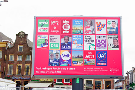 Groningen, Netherlands - March 3, 2023: Billboard with dutch political campaign posters for the Dutch House of Representatives elections in march 2023.のeditorial素材