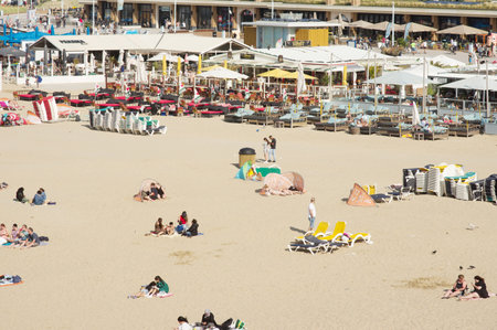 Scheveningen, Netherlands - August 24, 2021: People enjoying at a busy beach on a sunny dayのeditorial素材