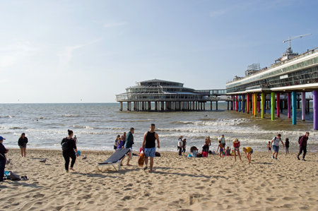 The Hague, Netherlands - August 24, 2021: People enjoying at a busy beach at the Pier in Scheveningen on a sunny dayのeditorial素材
