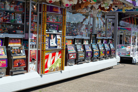Arnhem, Netherlands - May 13, 2023: Row with slot machines at a dutch fairのeditorial素材